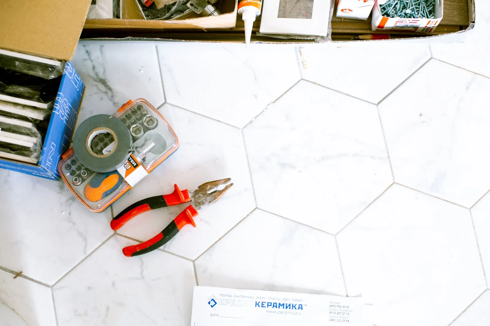 Repair tools on a tile floor for Peoria, AZ foundation guides