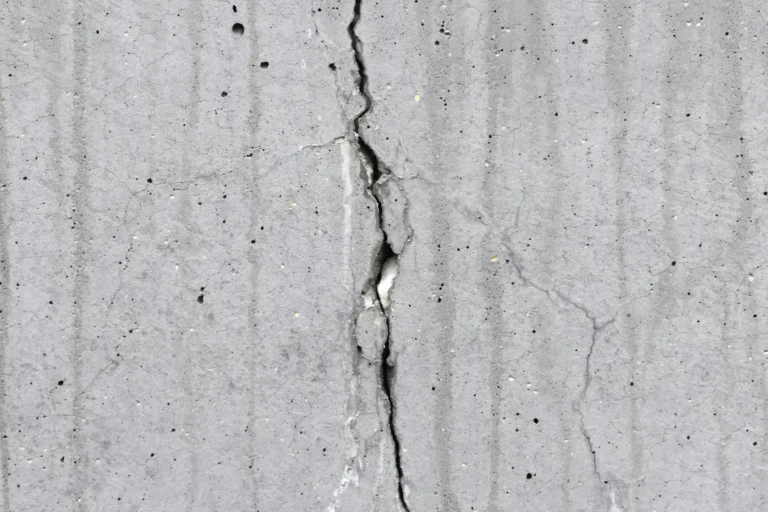 Concrete crack compared with stucco cracking on Peoria, AZ homes